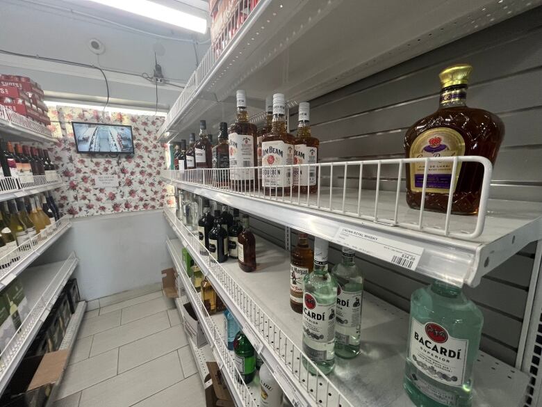 Some shelves are empty inside an LCBO convenience outlet.