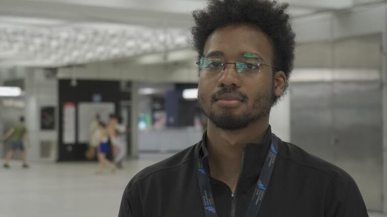 A man is seen indoors.