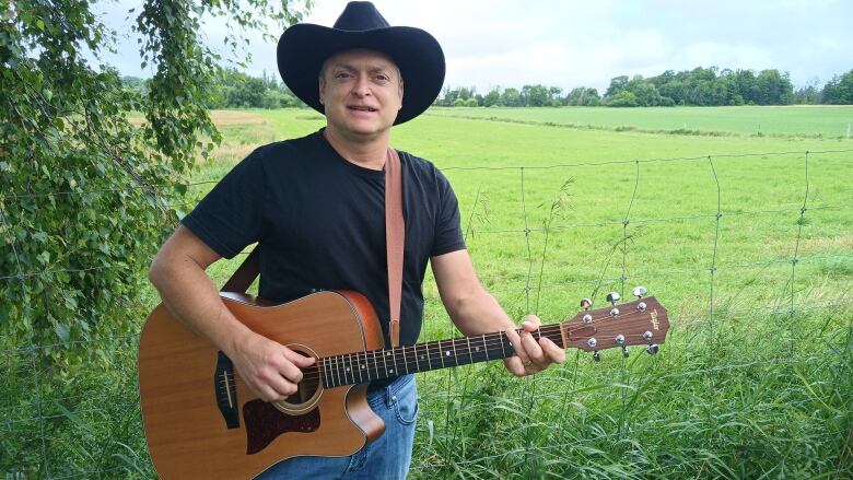 A man with a guitar.