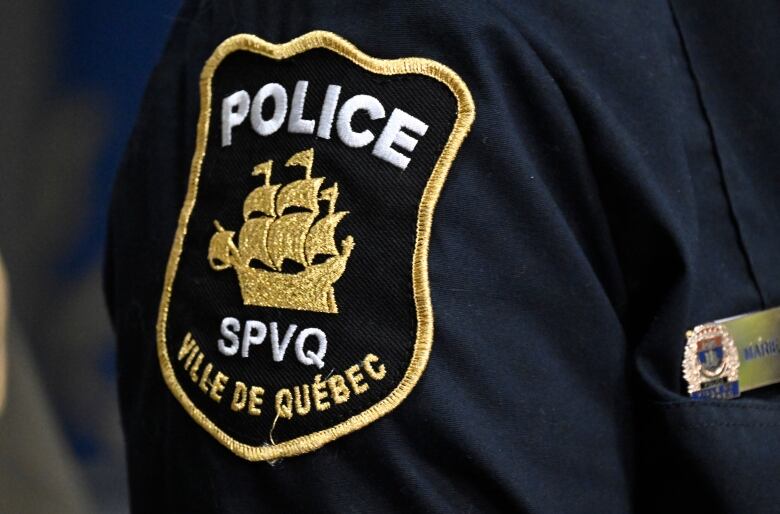 The Quebec City police forces patch at a news conference, in Quebec City. 