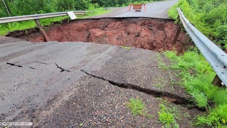 Picture of a large road washout in Truro 