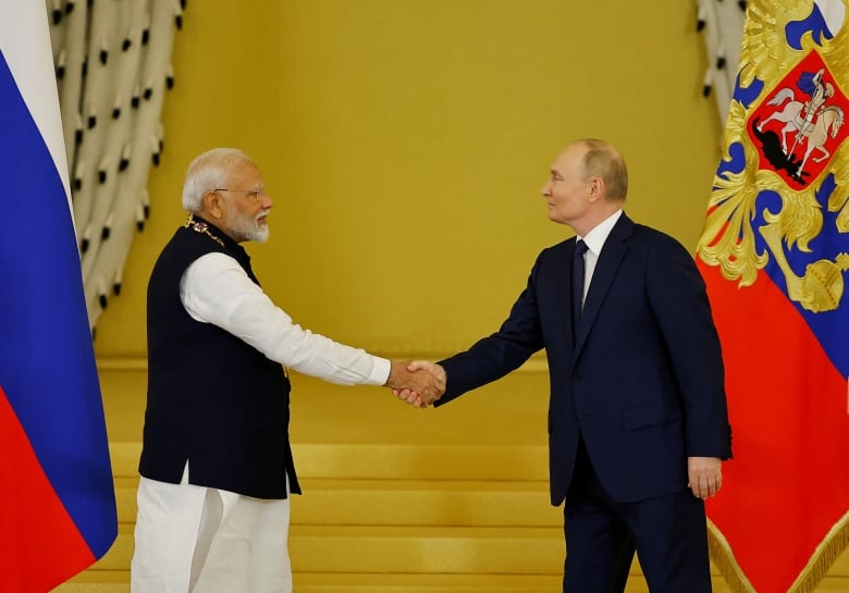 Russia's President Vladimir Putin awards India's Prime Minister Narendra Modi with the Order of St. Andrew the Apostle the First-Called at the Kremlin in Moscow, Russia July 9, 2024. 