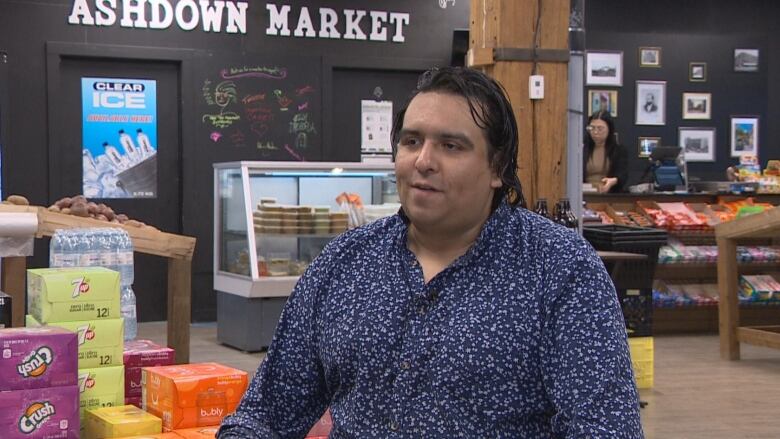 A man sitting at a store