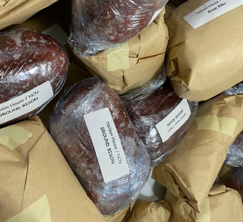 A bunch of packaged meat that says ground bison.