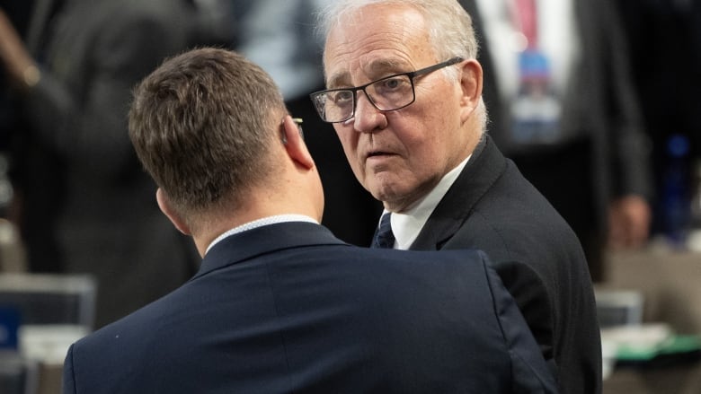 Minister of National Defence Bill Blair speaks with an international colleague before a meeting at the NATO Summit on Thursday, July 11, 2024 in Washington.