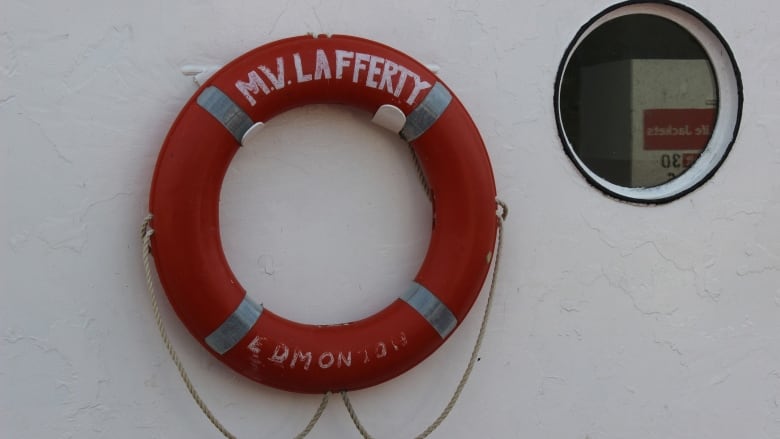 A red ring on a white wall. 