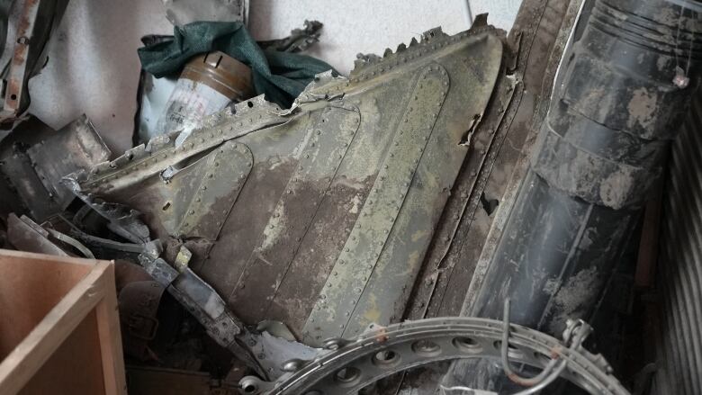 A part of a downed Russian aircraft sits outside of the Komanda-Ex store in Kyiv. The volunteer team was also given part of a Russian missile, which so far, they have been unable to sell. 