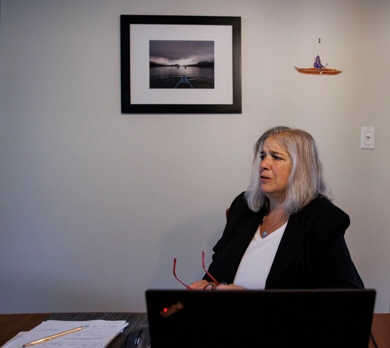 Lawyer Elaine Page, who specializes in landlord-tenant disputes, is pictured at her home office, in Toronto, on July 15, 2024.