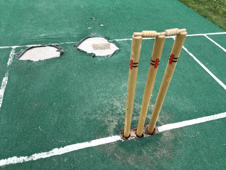 A damaged cricket pitch. 