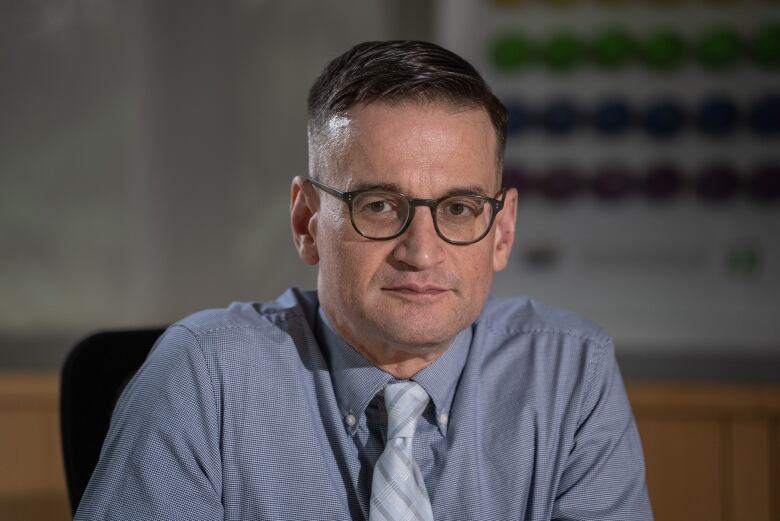 Man wearing a tie and glasses. 