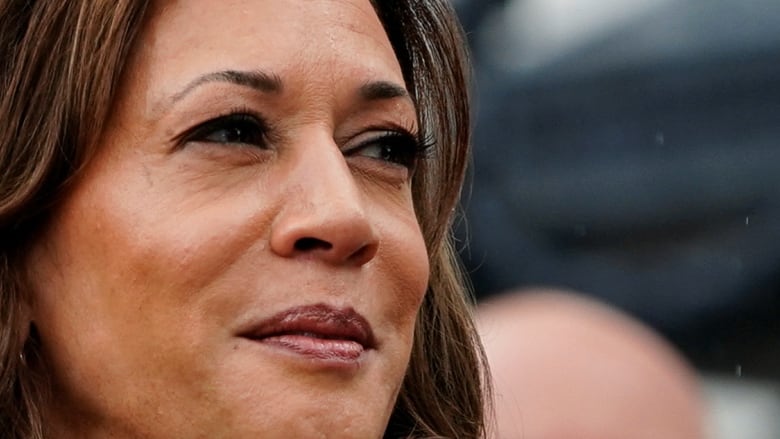 A close-up photo of a woman with shoulder-length black hair.