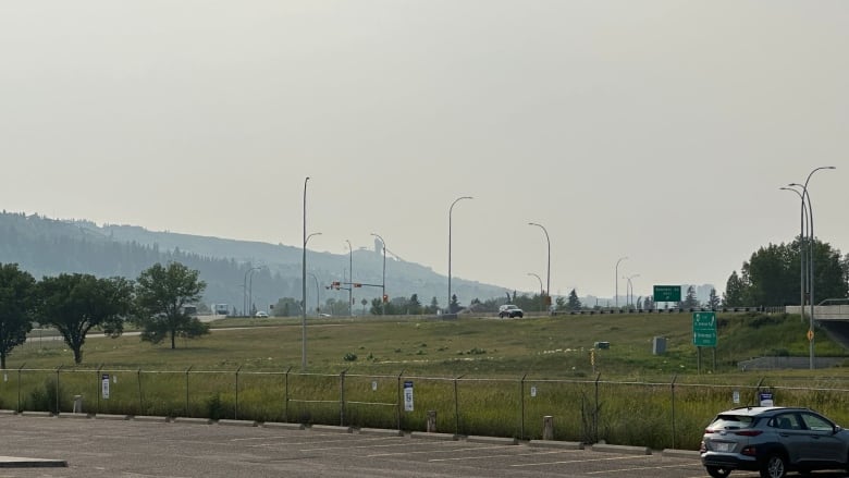 Hazy skies over a parking lot. 