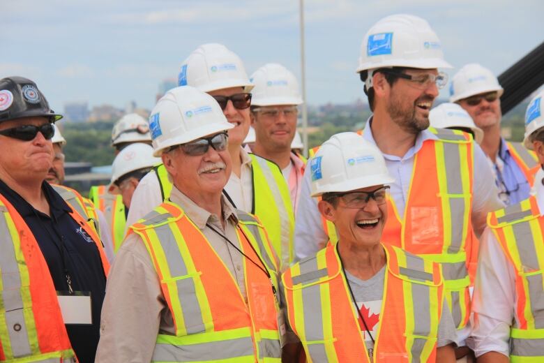 A group of people wearing safety gear.