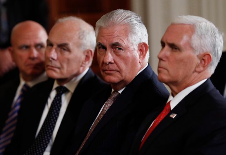 From left, H.R. McMaster, John Kelly, Rex Tillerson and Mike Pence, sit in the front row during a joint news conference with former U.S. President Donald Trump on Monday, Aug. 28, 2017, in the East Room of the White House in Washington.