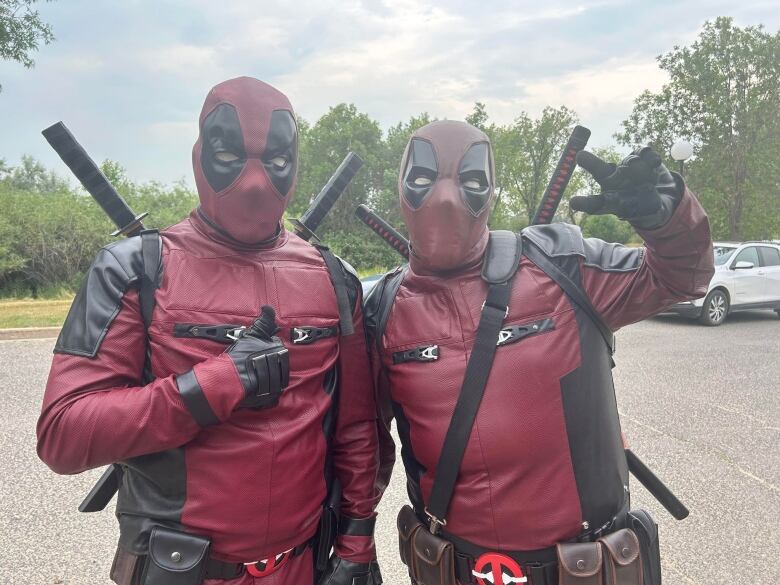 Two men in Deadpool cosplay.