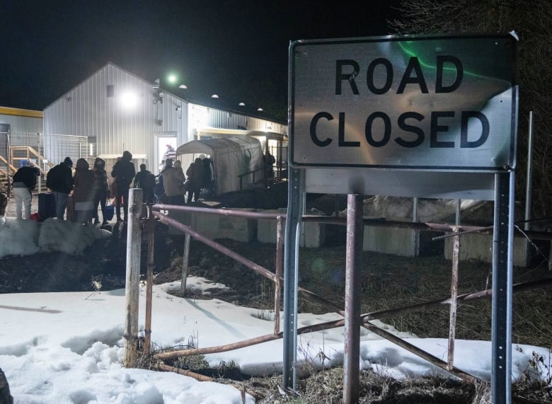 Asylum seekers try to beat the deadline to cross the border at Roxham Road from New York into Canada Friday March 24, 2023  in Champlain, NY.