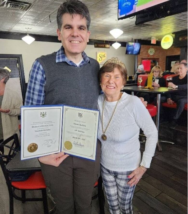 Windsor-Tecumseh MPP Andrew Dowie poses with Doreen Ouellette at her 90th birthday party.