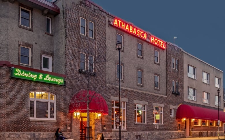 brick building with light-up sign