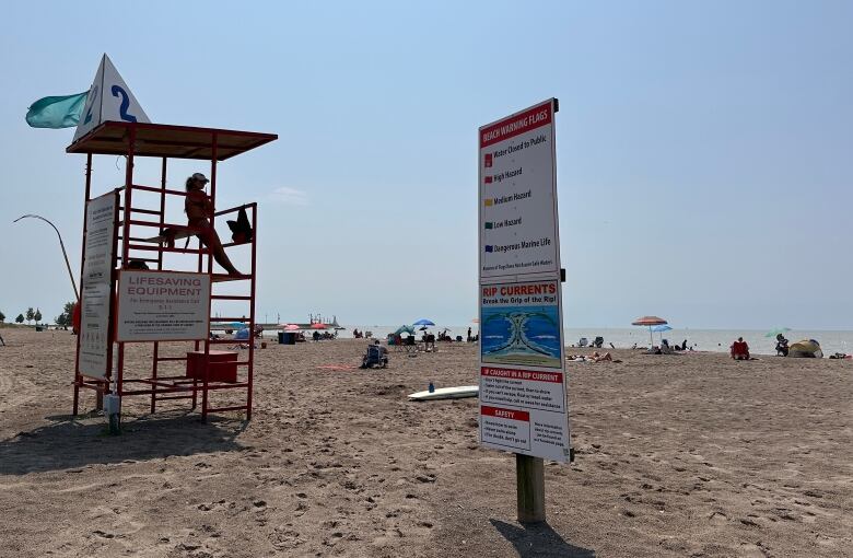 A lifeguard watches over the beach in Port Stanley, Ont., on July 31, 2024. It's a sunny day. 