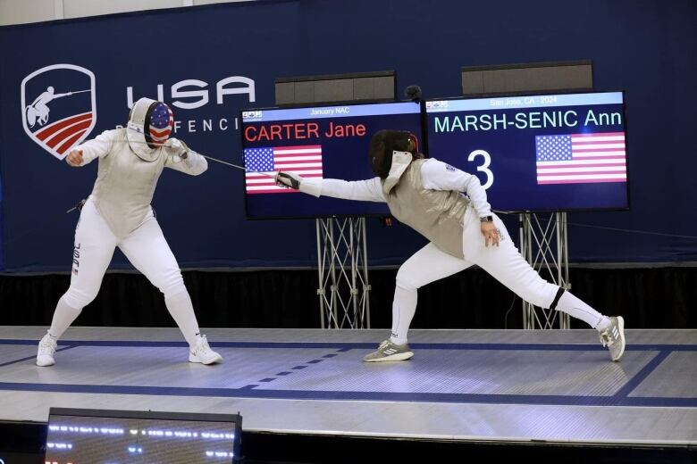 Two people fencing. 