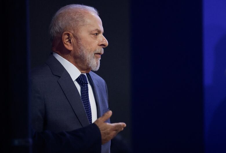 A man with a beard in a dark suit.