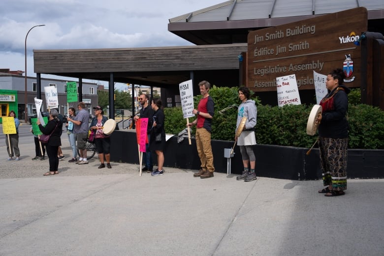 Protesters gathered outside the Yukon's Legislative Assembly to express frustration with the government and Victoria Gold's response and their failure to work with Na-Cho Nyk Dun leadership.  