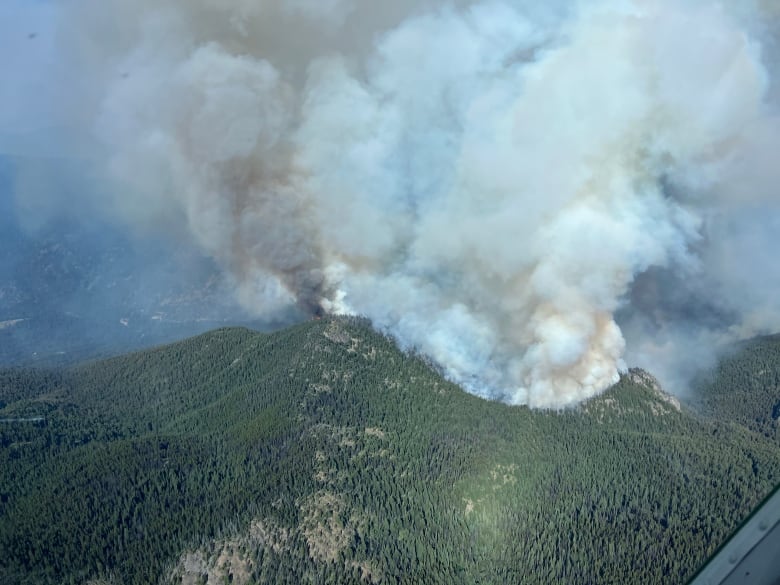 A hill and bellowing smoke