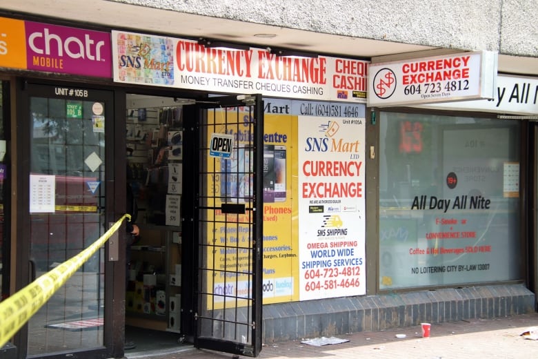 A currency exchange business readaing 'SNS Mart Currency Exchange'.