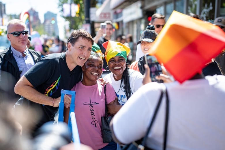 People posing for a photo during a parade.