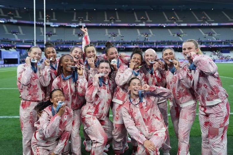 A rugby women's team cheer. 