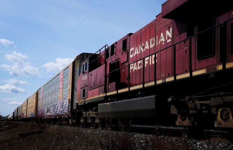 A train sits at a railyard.