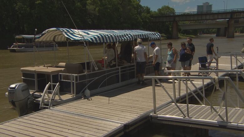 People get on a boat.