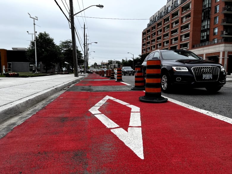 A red bus lane on a major road. 