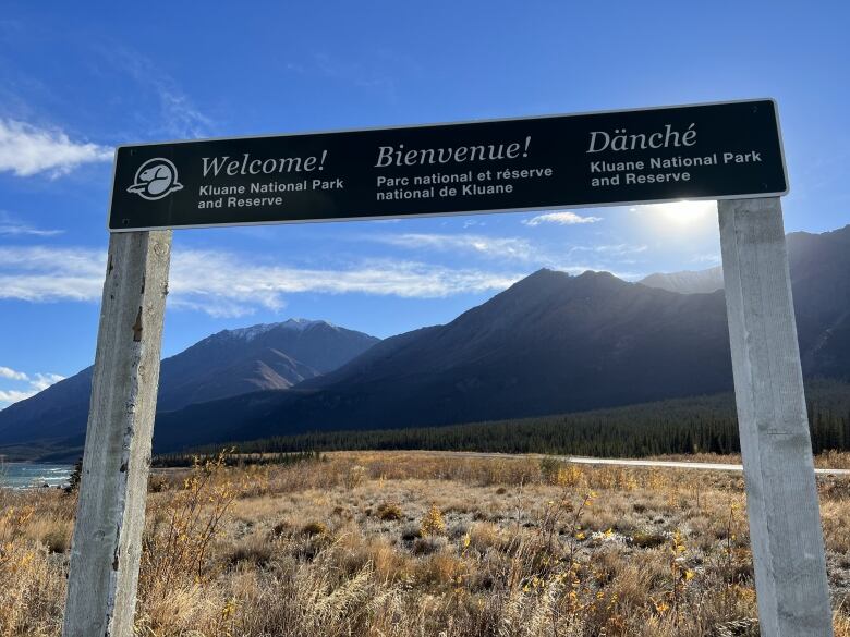 A sign welcomes people to Kluane National Park and Reserve.