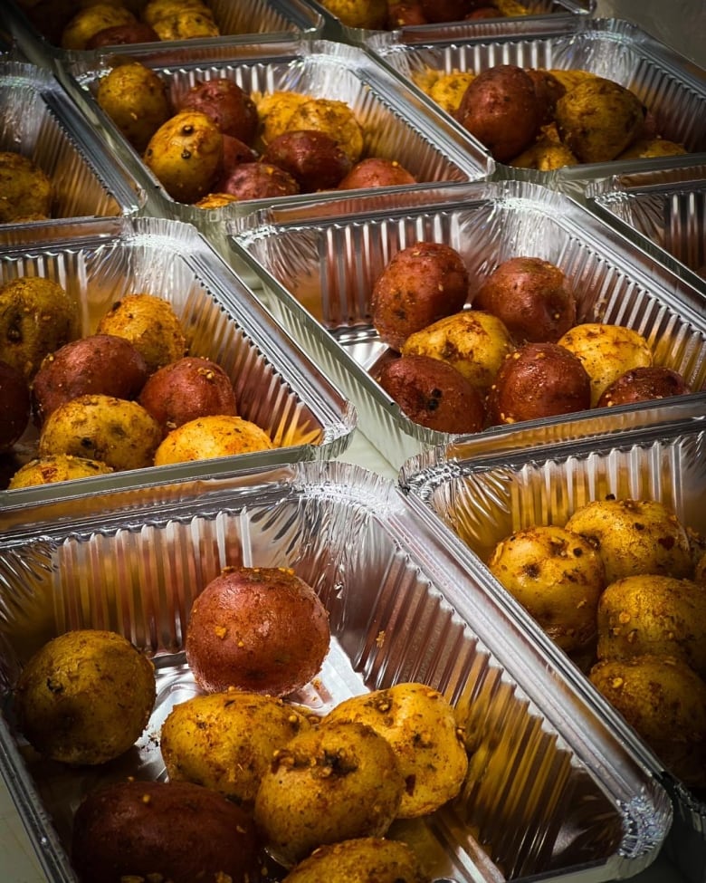 Potatoes in aluminum pans.