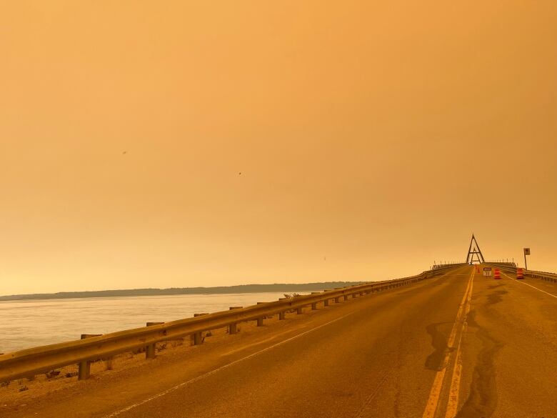 Orange skies on a bridge