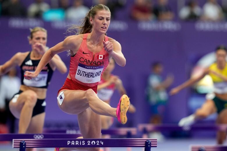 Canada's Savannah Sutherland runs in a women's 400-metre hurdles semifinal at the Summer Olympics in Paris on Tuesday, Aug.6, 2024. 