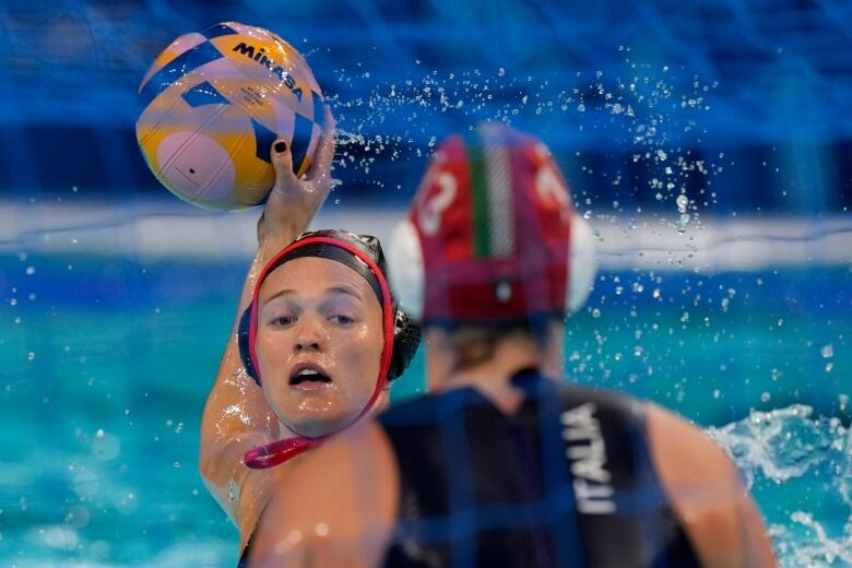 Canada's Blaire McDowell is about to score during a women's Water Polo 5th and 8th place classification match between Italy and Canada at the 2024 Summer Olympics, Thursday, Aug. 8, 2024, in Paris, France.