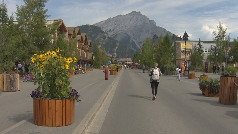 A street is pictured with a mountain in the background