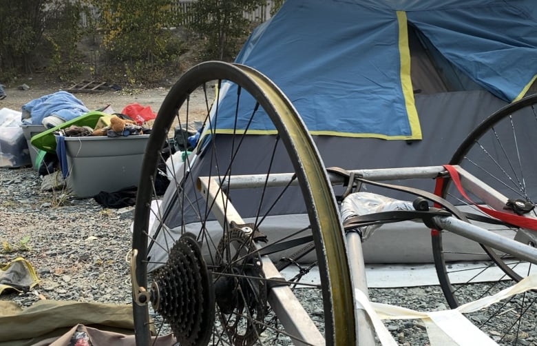 A bicycle tire and tent.