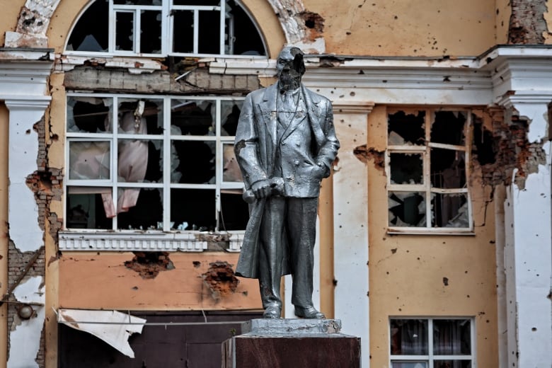 A damaged statue of Vladimir Lenin is seen, during a media tour, in the Ukrainian-controlled Russian town of Sudzha on Friday.