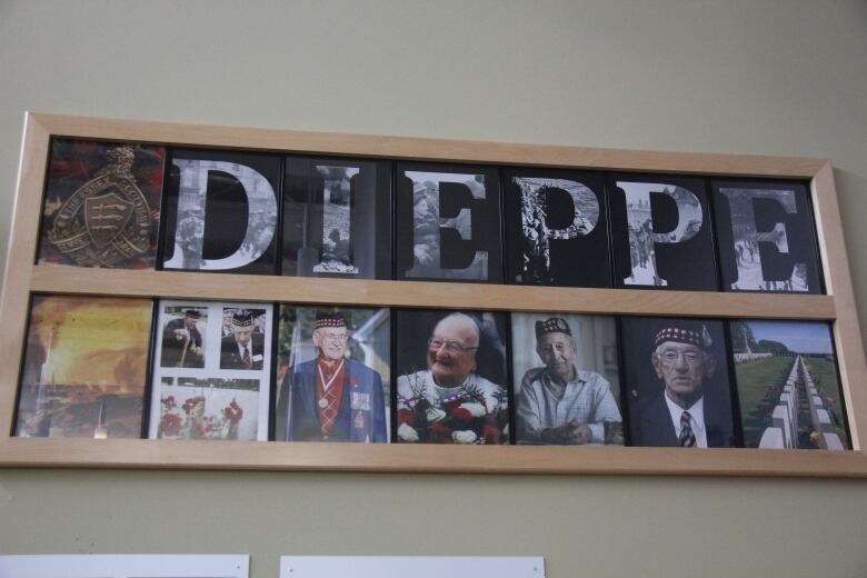 A wall of photos of veterans.