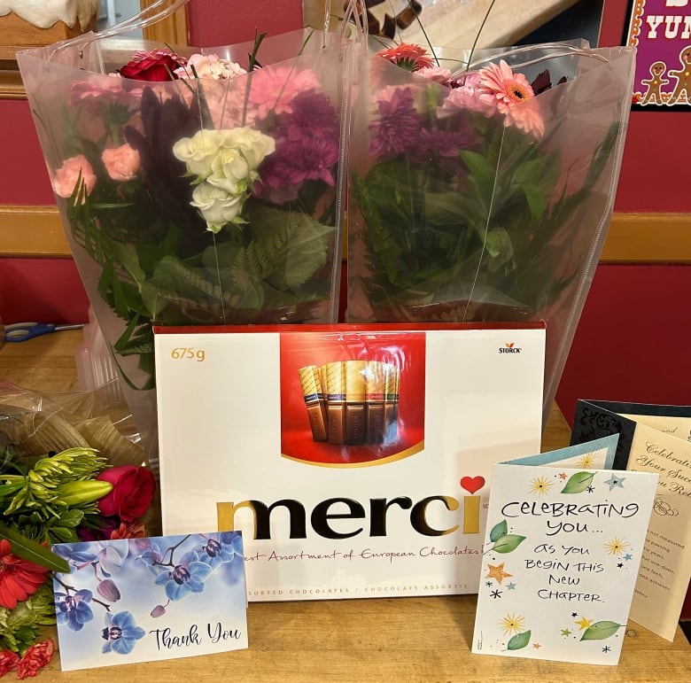 Flowers, chocolates and cards on display.