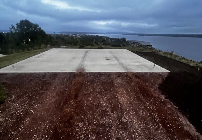 Topsail and a concrete platform with tire marks