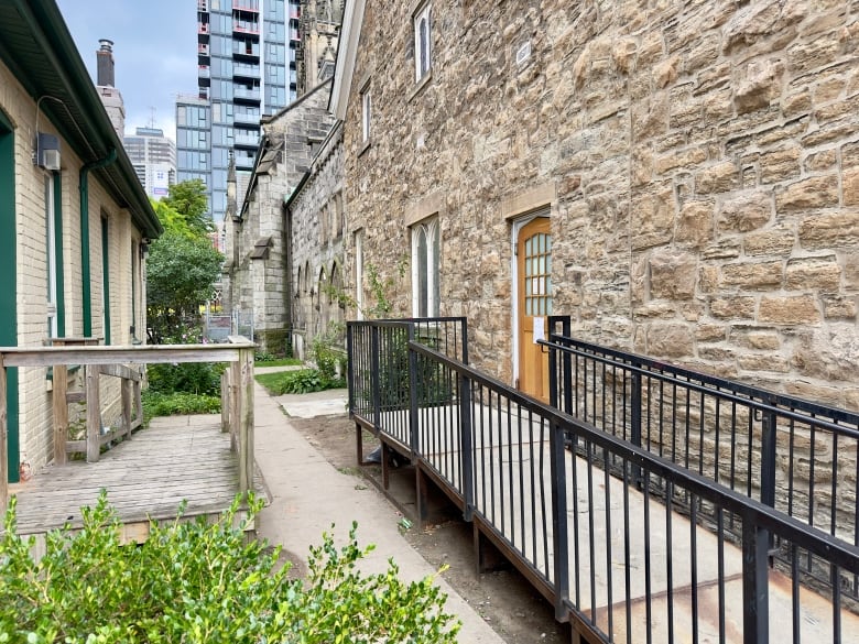 A narrow alleyway between two stone buildings. 