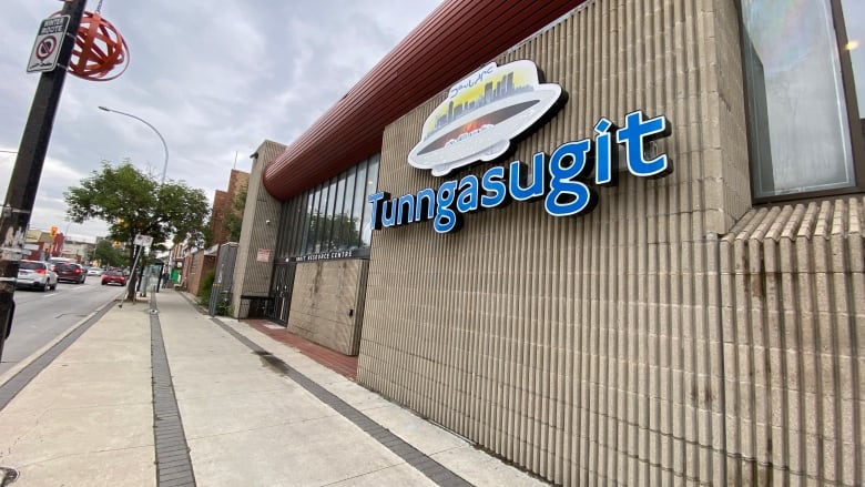 A building with the word 'Tunngasugit' on its facade