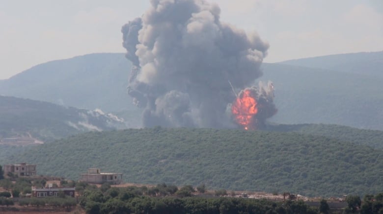 An explosion over a mountain.