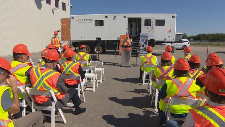 Education Minister JEremy Cockrill (at the podium) and other officials touted the benefits of a high school course in power engineering at a news conference Monday.