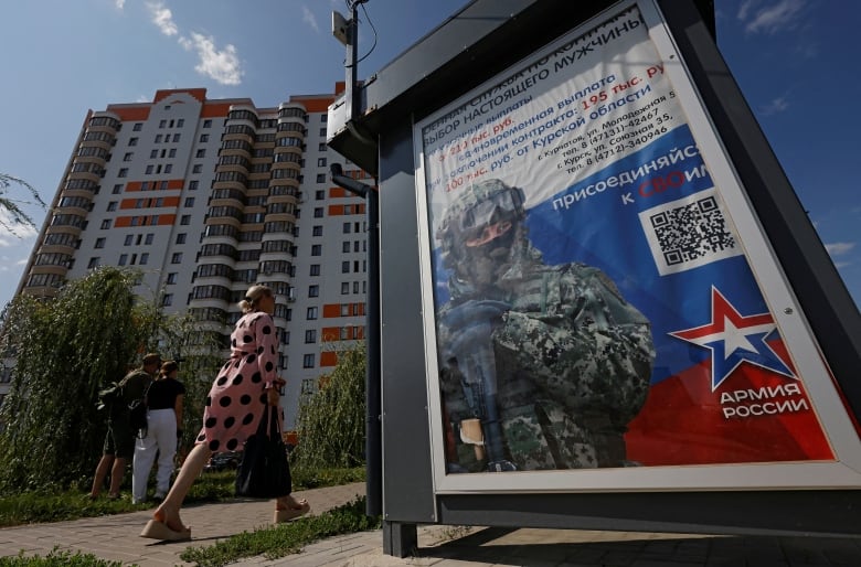 A poster promoting service with the Russian military is seen on display in Kurchatov, in Russia's Kursk region.