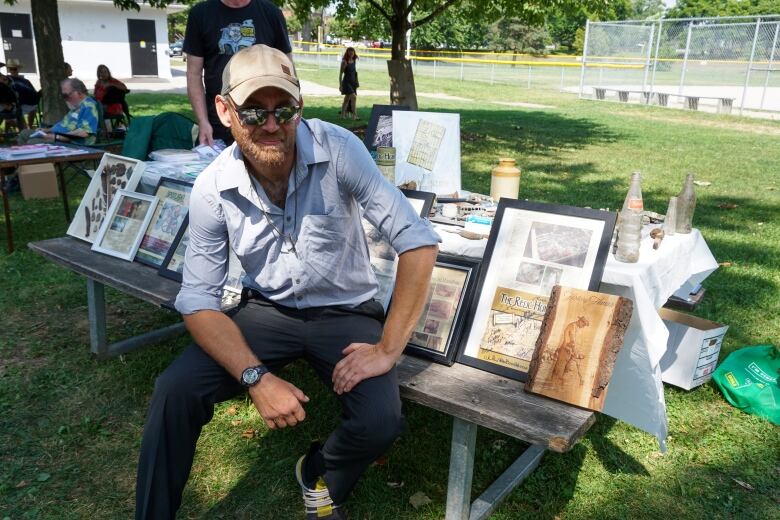 A man sitting at a park table